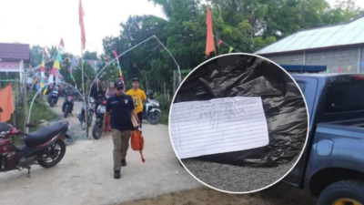 Petugas kepolisian saat melakukan olah tempat kejadian perkara (TKP) terkait kasus penemuan jasad bayi yang dibuang warga di area tempat ibadah.